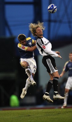 08.04.09.. Cardiff City v Derby County, Coca Cola Championship. -   Derby's Robbie Savage and Cardiff's Stephen McPhail go for the ball 