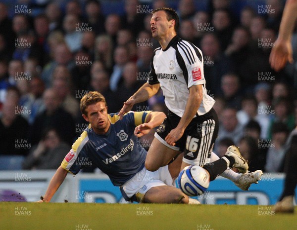 08.04.09.. Cardiff City v Derby County, Coca Cola Championship. -   Derby's Mile Sterjovski is brought down by Cardiff's Stephen McPhail 