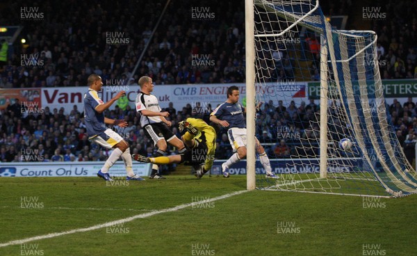 08.04.09.. Cardiff City v Derby County, Coca Cola Championship. -   Cardiff's Jay Bothroyd (lt) and Gavin Rae look on as Roger Johnson attempt at goal beats Derby's keeper Stephen Bywater to score 