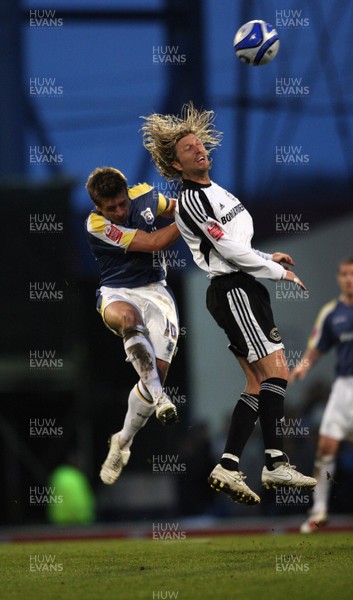 08.04.09.. Cardiff City v Derby County, Coca Cola Championship. -   Derby's Robbie Savage and Cardiff's Stephen McPhail go for the ball 