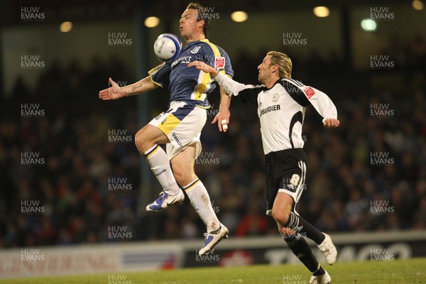 08.04.09.. Cardiff City v Derby County, Coca Cola Championship. -   Cardiff's Gavin Rae beats Derby's Robbie Savage to the ball 