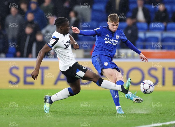 010322 - Cardiff City v Derby County, Sky Bet Championship - Joel Bagan of Cardiff City plays the ball forward as Festy Ebosele of Derby County challenges