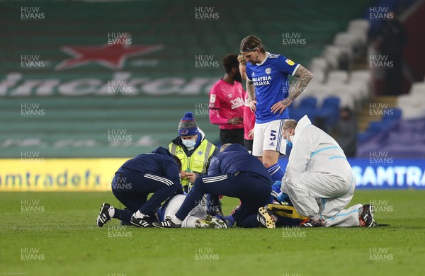 020321 - Cardiff City v Derby County, Sky Bet Championship - Joe Bennett of Cardiff City receives attention after he goes down with an injury