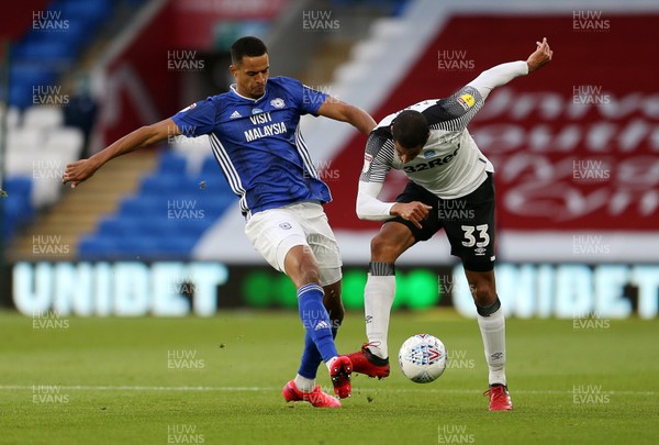 140720 - Cardiff City v Derby County - SkyBet Championship - Curtis Davies of Derby County is tackled by Robert Glatzel of Cardiff City