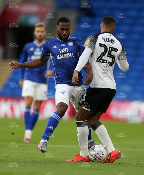 140720 - Cardiff City v Derby County - SkyBet Championship - Max Lowe of Derby County is tackled by Junior Hoilett of Cardiff City
