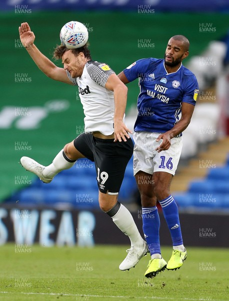 140720 - Cardiff City v Derby County - SkyBet Championship - Chris Martin of Derby County and Curtis Nelson of Cardiff City go up for the ball