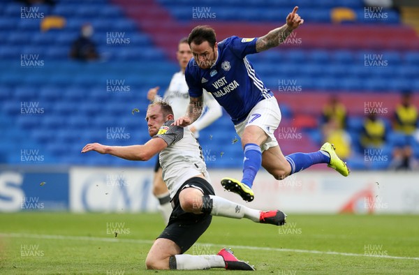 140720 - Cardiff City v Derby County - SkyBet Championship - Lee Tomlin of Cardiff City is tackled by Matthew Clarke of Derby County