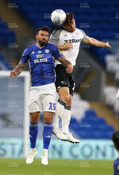 140720 - Cardiff City v Derby County - SkyBet Championship - Marlon Pack of Cardiff City and Chris Martin of Derby County go up for the ball