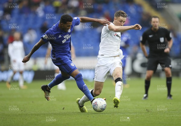 300917 - Cardiff City v Derby County, Sky Bet Championship - Nathaniel Mendez-Laing of Cardiff City and Craig Forsyth of Derby County tangle as they compete for the ball