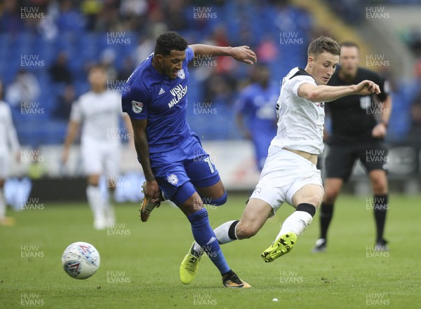 300917 - Cardiff City v Derby County, Sky Bet Championship - Nathaniel Mendez-Laing of Cardiff City and Craig Forsyth of Derby County tangle as they compete for the ball