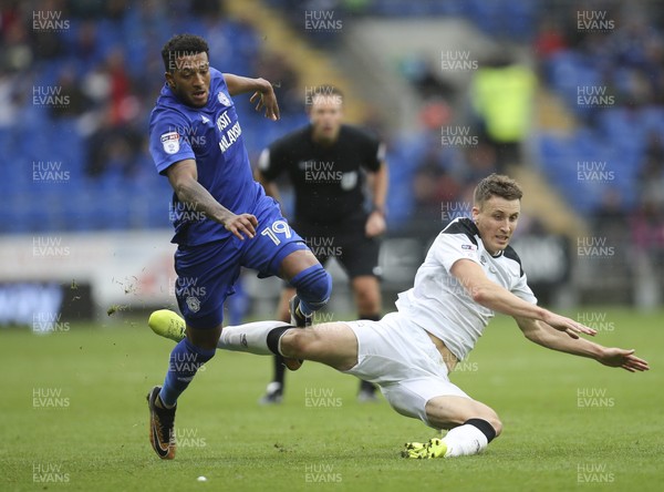 300917 - Cardiff City v Derby County, Sky Bet Championship - Nathaniel Mendez-Laing of Cardiff City and Craig Forsyth of Derby County tangle as they compete for the ball