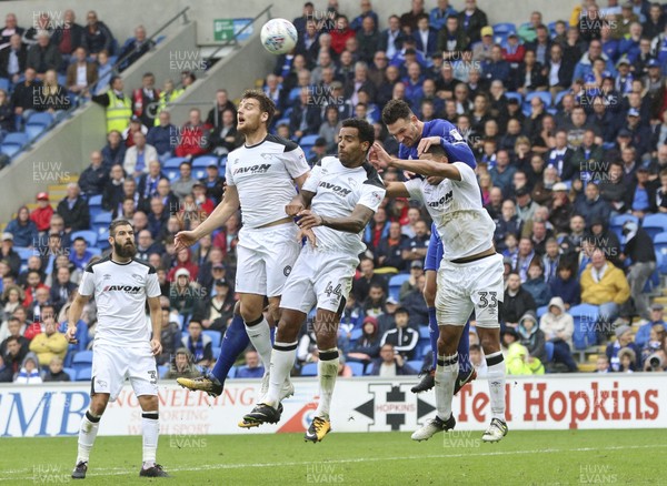 300917 - Cardiff City v Derby County, Sky Bet Championship - Sean Morrison of Cardiff City tries to get above Curtis Davies of Derby County to head at goal