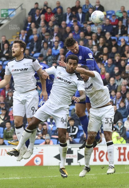 300917 - Cardiff City v Derby County, Sky Bet Championship - Sean Morrison of Cardiff City gets above Tom Huddlestone of Derby County and Curtis Davies of Derby County to head at goal