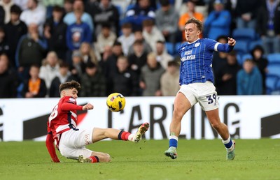 131225 - Cardiff City v Doncaster Rovers - SkyBet League One - Isaak Davies of Cardiff is tackled by Charlie Crew of Doncaster 