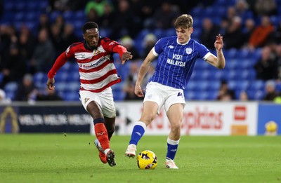 131225 - Cardiff City v Doncaster Rovers - SkyBet League One - Dylan Lawlor of Cardiff is challenged by Brandon Hanlan of Doncaster 