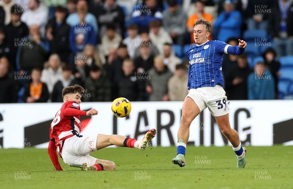 131225 - Cardiff City v Doncaster Rovers - SkyBet League One - Isaak Davies of Cardiff is tackled by Charlie Crew of Doncaster 
