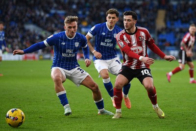 261225 - Cardiff City v Exeter City - Sky Bet League 1 - Isaak Davies of Cardiff City is challenged by Jack Aitchison of Exeter