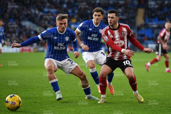 261225 - Cardiff City v Exeter City - Sky Bet League 1 - Isaak Davies of Cardiff City is challenged by Jack Aitchison of Exeter