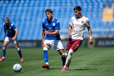 110726 - Cardiff City v FC Midtjylland - Preseason Friendly - Jack Sykes of Cardiff City is challenged by Dario Osorio of FC Midtylland