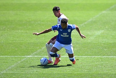 110726 - Cardiff City v FC Midtjylland - Preseason Friendly - Chris Willock of Cardiff City is challenged by Dario Osorio of FC Midtylland