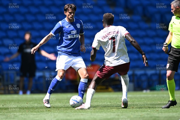110726 - Cardiff City v FC Midtjylland - Preseason Friendly - Perry NG of Cardiff City is challenged by Dju Franchulino of FC Midtylland