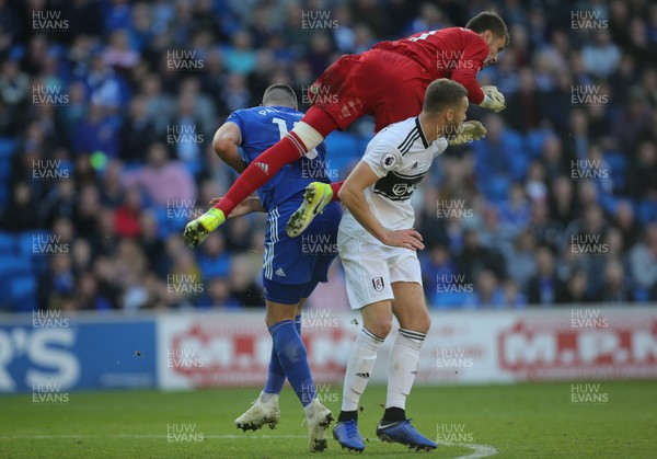 201018 - Cardiff City v Fulham, Premier League - Fulham goalkeeper Marcus Bettinelli is upended as he heads the ball clear