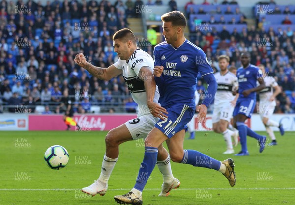 201018 - Cardiff City v Fulham, Premier League - Victor Camarasa of Cardiff City and Aleksandar Mitrovic of Fulham compete for the ball