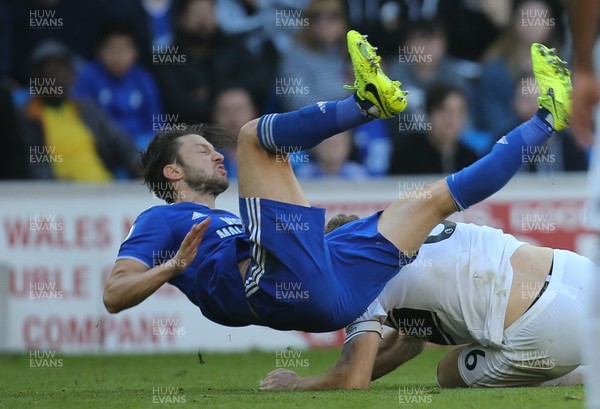 201018 - Cardiff City v Fulham, Premier League - Harry Arter of Cardiff City is tackled by Kevin McDonald of Fulham
