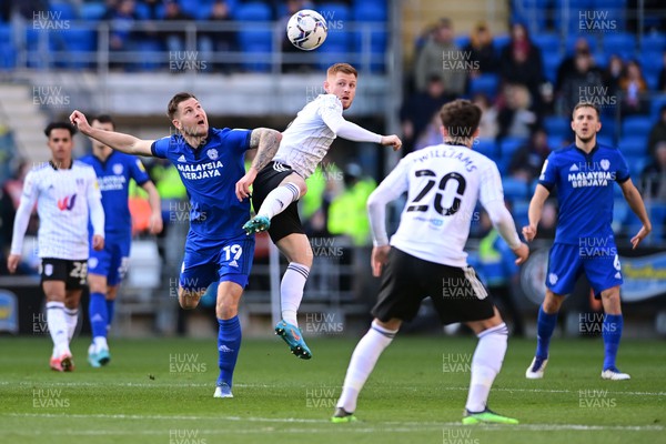 260222 - Cardiff City v Fulham - Sky Bet Championship - James Collins of Cardiff City battles with Harrison Reed of Fulham 