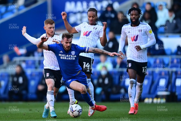 260222 - Cardiff City v Fulham - Sky Bet Championship - Joe Ralls of Cardiff City is fouled by Harrison Reed of Fulham 