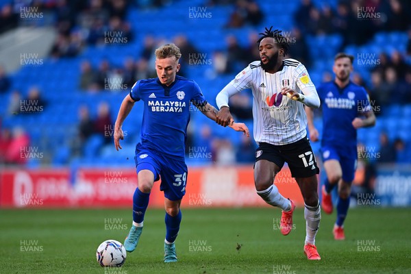 260222 - Cardiff City v Fulham - Sky Bet Championship - Isaak Davies of Cardiff City under pressure from Nathaniel Chalobah of Fulham 