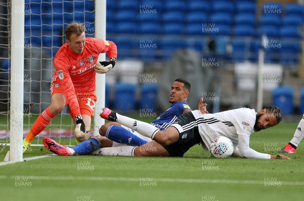 270720 - Cardiff City v Fulham - SkyBet Championship Play off - First leg - Michael Hector of Fulham keeps the ball away from Robert Glatzel of Cardiff City at the goalmouth as keeper Marek Rodak of Fulham scrambles for the ball