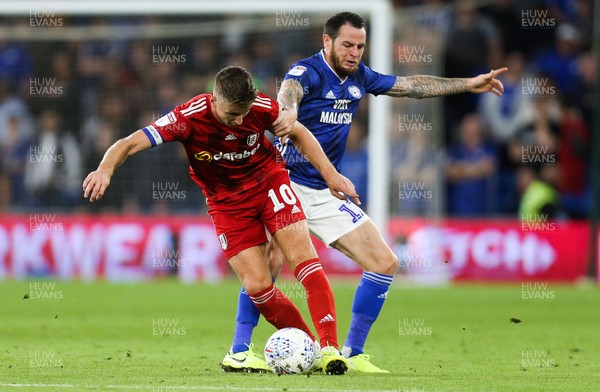 300819 - Cardiff City v Fulham, Sky Bet Championship - Lee Tomlin of Cardiff City and Tom Cairney of Fulham compete for the ball