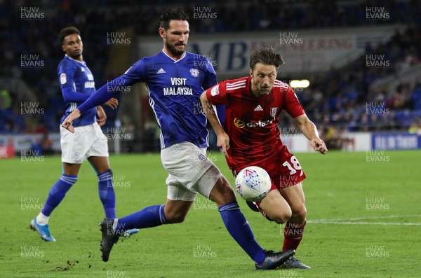 300819 - Cardiff City v Fulham, Sky Bet Championship - Harry Arter of Fulham goes down as he competes with Sean Morrison of Cardiff City for the ball
