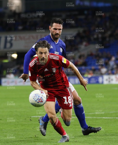 300819 - Cardiff City v Fulham, Sky Bet Championship - Harry Arter of Fulham goes down as he competes with Sean Morrison of Cardiff City for the ball