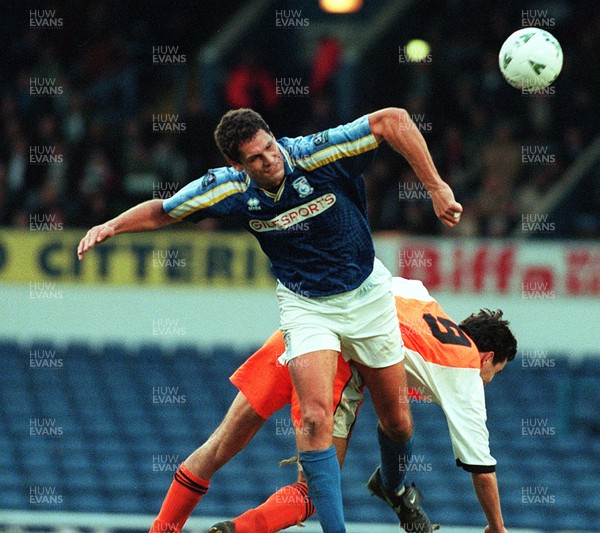 061297 - Cardiff City v Hendon - Colin Simpson of Cardiff is challenged by Mark Harristangles