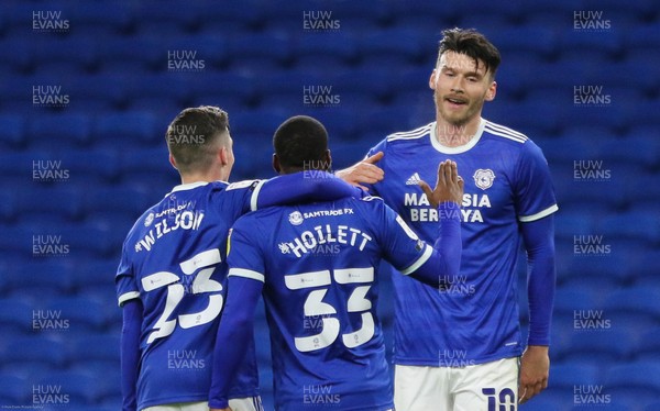 011220 - Cardiff City v Huddersfield Town, Sky Bet Championship - Kieffer Moore of Cardiff City celebrates with Harry Wilson of Cardiff City and Junior Hoilett of Cardiff City after he scores the second goal of the match