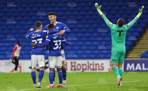 011220 - Cardiff City v Huddersfield Town, Sky Bet Championship - Huddersfield Town goalkeeper Ben Hamer reacts as Kieffer Moore of Cardiff City celebrates with Harry Wilson of Cardiff City and Junior Hoilett of Cardiff City after he scores the second goal of the match