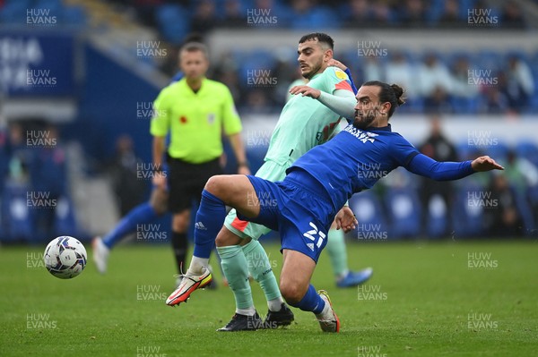061121 - Cardiff City v Huddersfield Town - Sky Bet Championship - Danel Sinani of Huddersfield Town vies for possession with Marlon Pack of Cardiff City 
