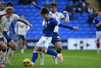 061225 - Cardiff City v Huddersfield Town - Sky Bet League 1 - Cian Ashford of Cardiff City is challenged by Ryan Ledson of Huddersfield