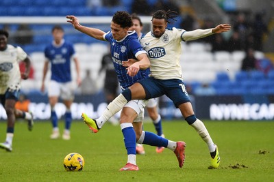 061225 - Cardiff City v Huddersfield Town - Sky Bet League 1 - Yousef Salech of Cardiff City is challenged by David Kasumu of Huddersfield