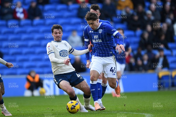 061225 - Cardiff City v Huddersfield Town - Sky Bet League 1 - Cian Ashford of Cardiff City is challenged by Ryan Ledson of Huddersfield