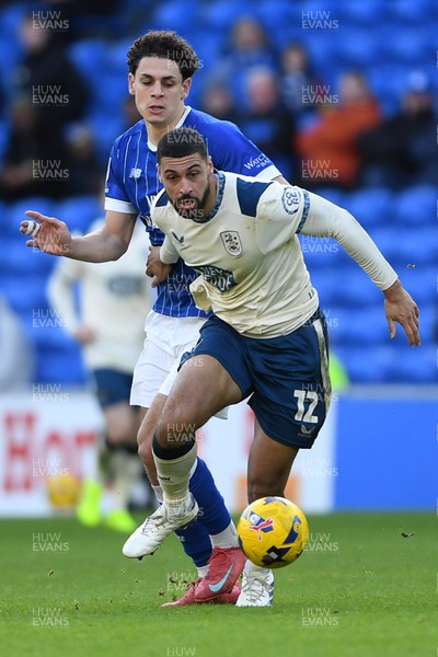 061225 - Cardiff City v Huddersfield Town - Sky Bet League 1 - Yousef Salech of Cardiff City is challenged by Radinio Balker of Huddersfield
