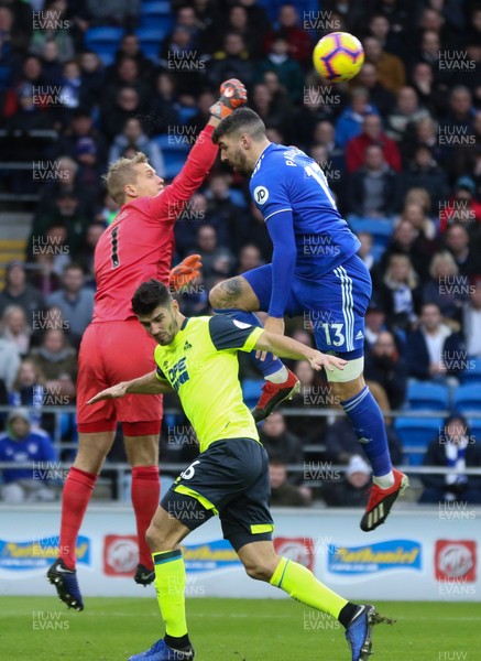 120119 -  Cardiff City v Huddersfield Town, Premier League - Callum Paterson of Cardiff City is denied a headed attempt at goal as Huddersfield goalkeeper Jonas Lossl punches the ball clear
