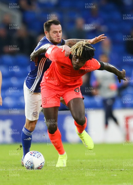 210819 - Cardiff City v Huddersfield Town, Sky Bet Championship - Lee Tomlin of Cardiff City tries to get the ball from Trevoh Chalobah of Huddersfield Town