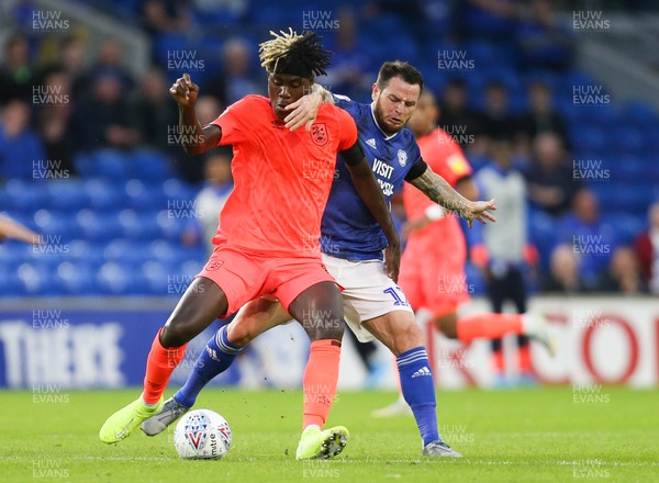 210819 - Cardiff City v Huddersfield Town, Sky Bet Championship - Lee Tomlin of Cardiff City tries to get the ball from Trevoh Chalobah of Huddersfield Town