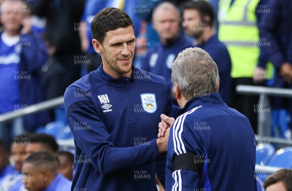 210819 - Cardiff City v Huddersfield Town, Sky Bet Championship - Huddrsfield Town caretaker manager Mark Hudson greets Cardiff City manager Neil Warnock at the start of the match