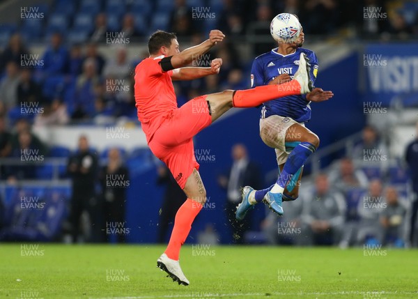 210819 - Cardiff City v Huddersfield Town, Sky Bet Championship - Tommy Elphick of Huddersfield Town catches Josh Murphy of Cardiff City as he goes for a high kick