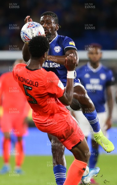 210819 - Cardiff City v Huddersfield Town, Sky Bet Championship - Omar Bogle of Cardiff City collides with Terence Kongolo of Huddersfield Town as he looks to win the ball
