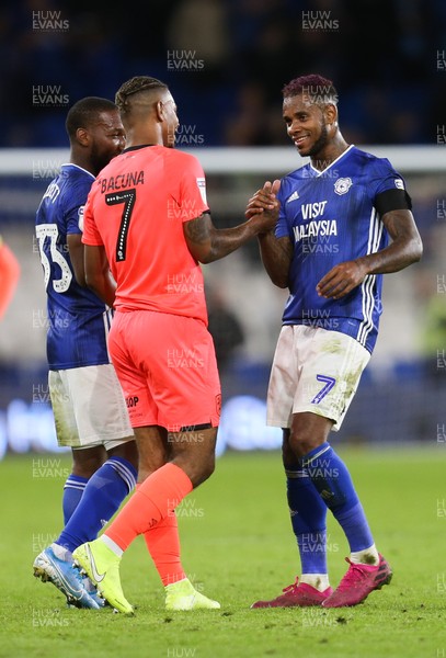 210819 - Cardiff City v Huddersfield Town, Sky Bet Championship - Brothers Juninho Bacuna of Huddersfield Town and Leandro Bacuna of Cardiff City greet each other at the end of the match